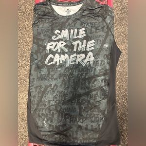 Under Armour. Short sleeve. $25 sleeveless $25